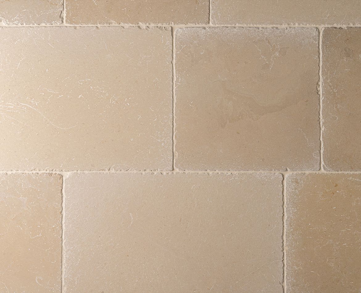 Dettaglio di lastra in pietra beige effetto naturale